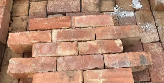 Premium reclaimed wirecut red bricks close up